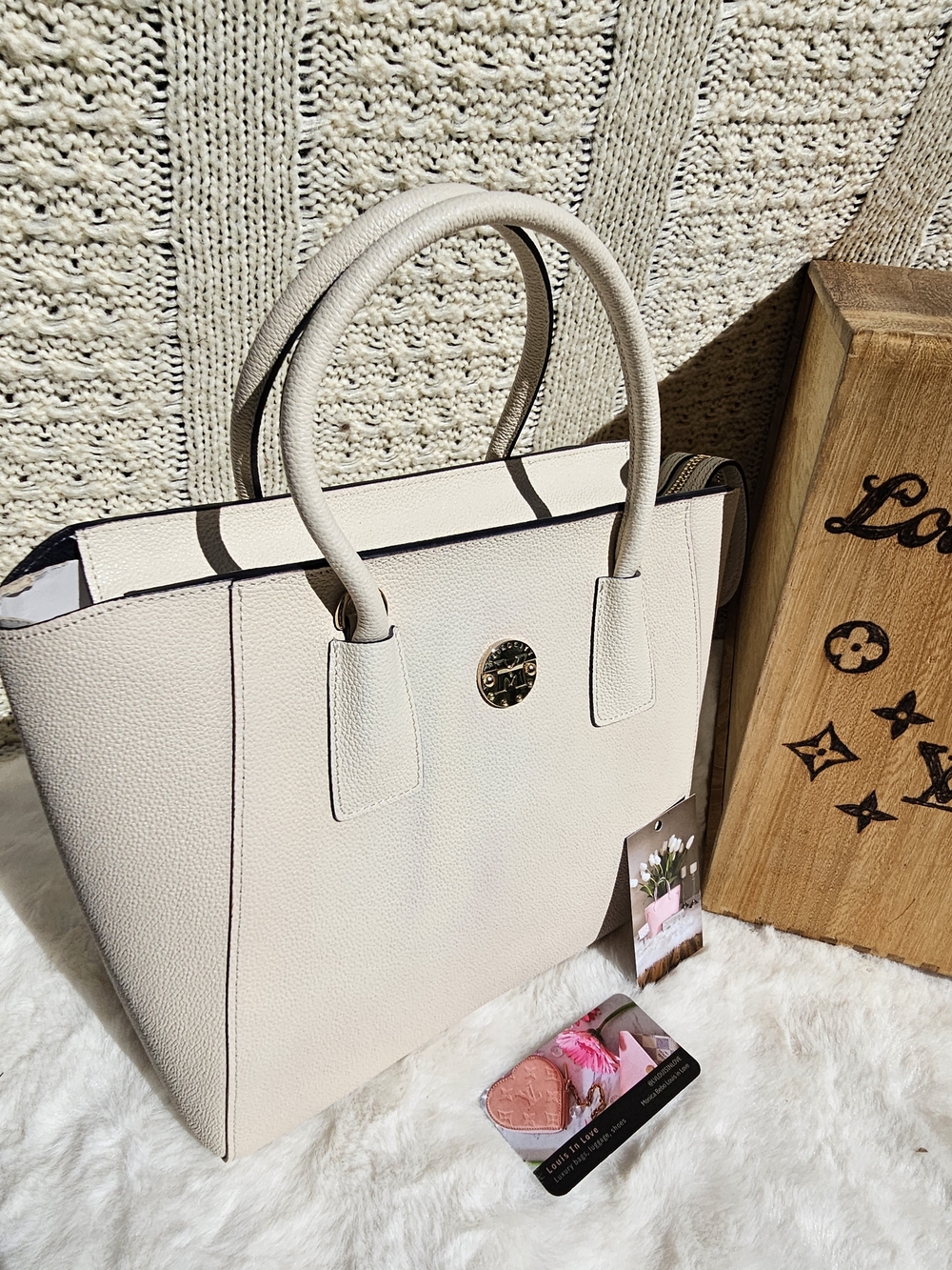 Metrocity Cream Pebbled Leather Tote with Gold Emblem